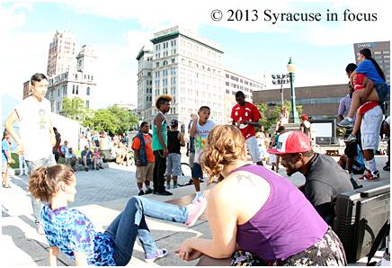 Some folk from the Syracuse Dance Project, along with some freelancers, occupy the Soldiers and Sailors Monument in Clinton Sqaure between the World Beat and Mardi Gras Pavillions.